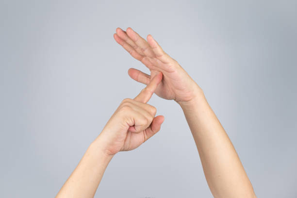 istock TimeOut sign and simbol from Asian human hand with isolate white background and clipping path. 1172434120