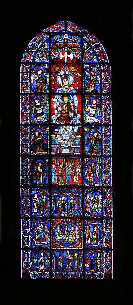 Stained Glass Window at Chartres Cathedral Blue Virgin - one of the oldest (11th-12th century) and most famous stained glass windows of the Chartres Cathedral, France. chartres cathedral stock pictures, royalty-free photos & images