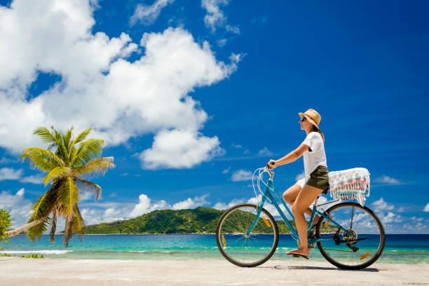 istock Woman ride along The Beach 1172434810