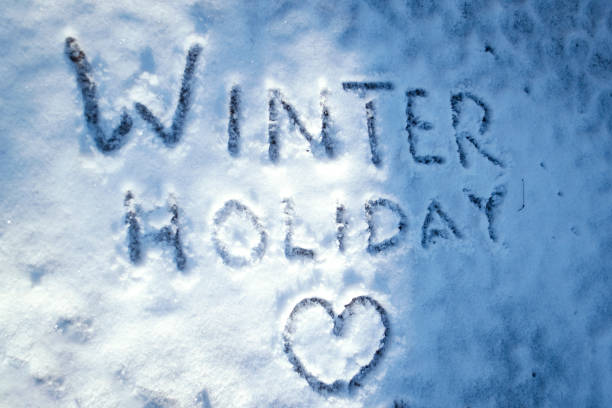 istock 'Winter Holiday' written in the snow 1172434826