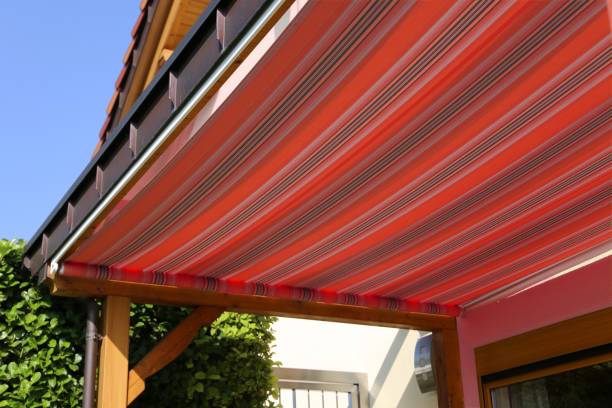 New awning in a back yard New awning in a back yard Sunblind stock pictures, royalty-free photos & images