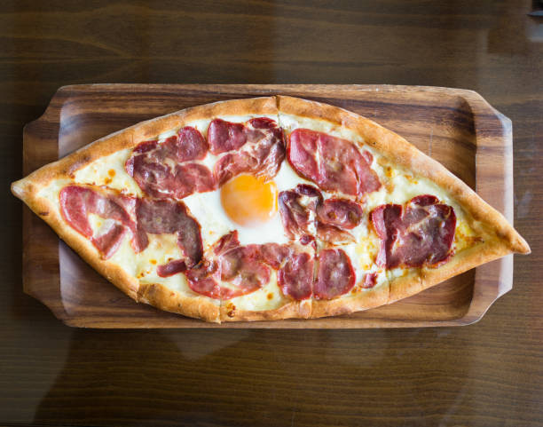 istock Turkish pide with bacon and egg ready to eat 1172436126
