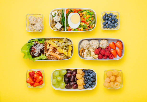 istock Pattern of plastic lunch boxes filled with healthy food 1172438154