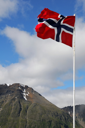 The Norwegian flag against a blue sky
