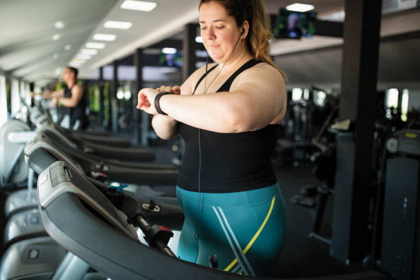 Overweight women at gym stock photo