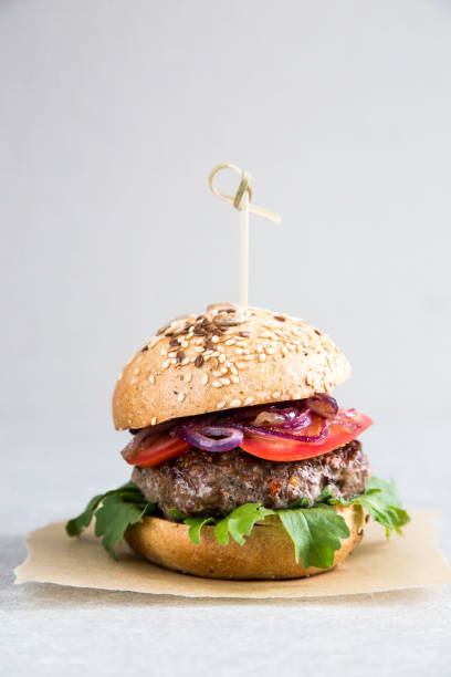 Craft homemade beef burger and french fries. Light background, copy space. stock photo