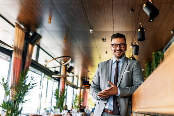 istock Young businessman at bar counter 1172442346
