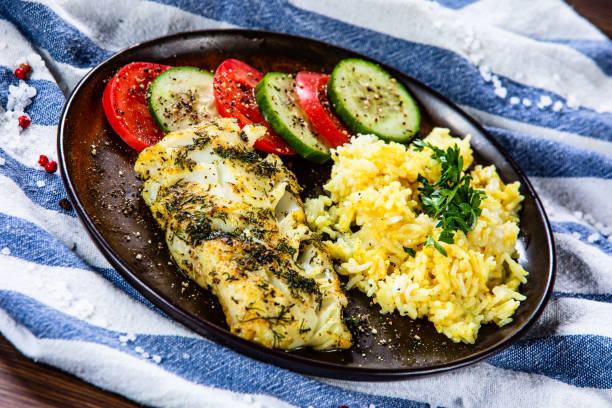 istock Fish dish - fried fish fillet and vegetables 1172442572
