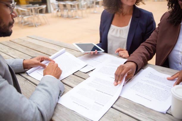 istock Legal experts reviewing customer documents 1172444018