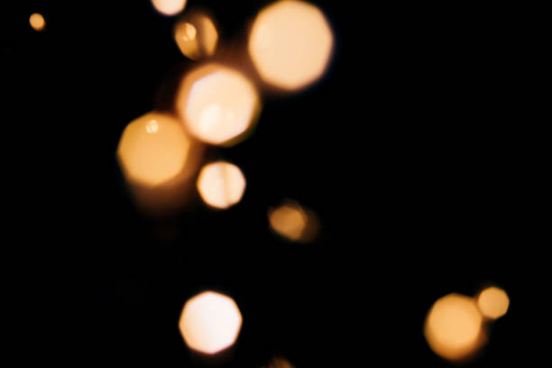 istock Golden abstract bokeh sparkle on black isolated background. Holiday concept. 1172445366