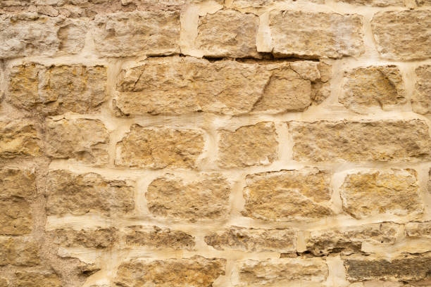 istock Rocky brick wall. stone wall background. abstract grunge texture. old brown masonry 1172452274