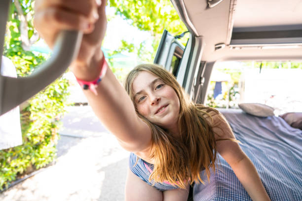 istock Naughty blond girl closing van door 1172453531