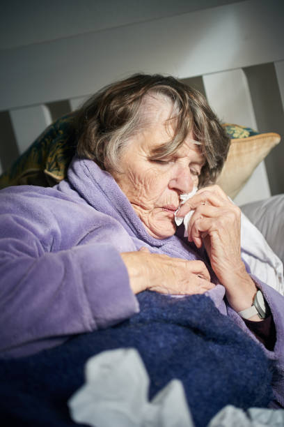 istock Sick senior woman asleep in bed 1172453747