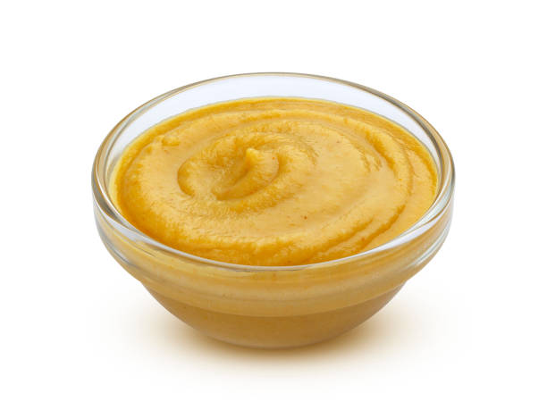 istock Mustard sauce in bowl isolated on white background 1172455908