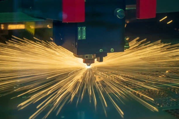 istock The fiber laser cutting machine control by CNC program cutting the sheet metal with the sparking light. 1172456817