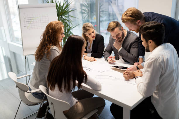 istock Team of architects working together on project 1172460822