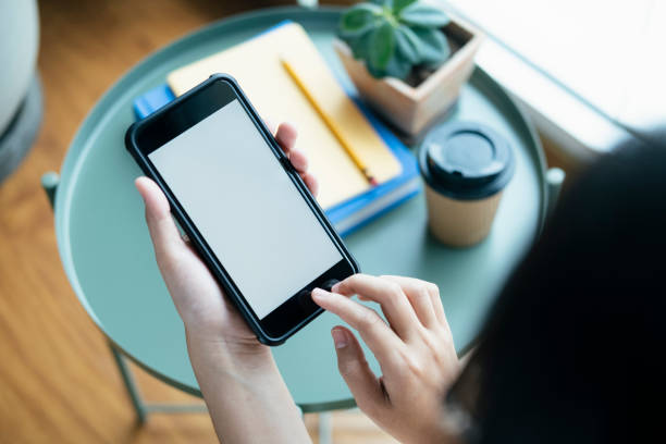 istock Closeup hands using smartphone mockup at the office desk. 1172464189