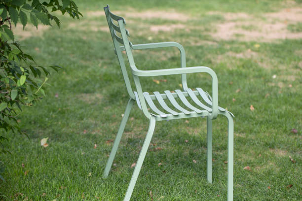 istock Chairs in the green garden 1172464839