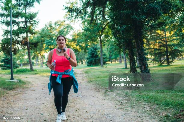 Young Overweight Woman Running Stock Photo - Download Image Now - Power Walking, Overweight, Women
