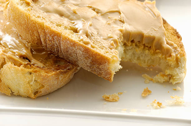 istock Peanut butter on toast close-up 117246703