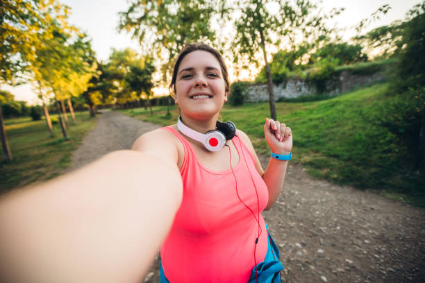 Oversized woman selfie at running