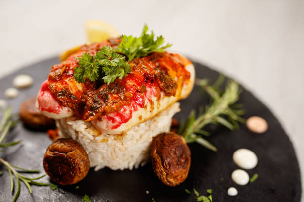 code di aragosta servite su piatto di granito - lobster steak lobster tail main course foto e immagini stock