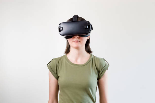 istock Brunette woman exploring modern technology virtual reality with head mounted display on white background 1172471346