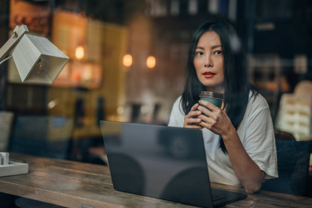 istock Modern Chinese lady sitting in cafe 1172473910