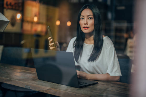 istock Beautiful woman sitting in cafe 1172474298