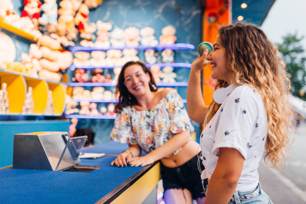 istock Girlfriends have fun at the amusement park 1172474316