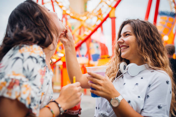 istock Girlfriends have fun at the amusement park 1172474580