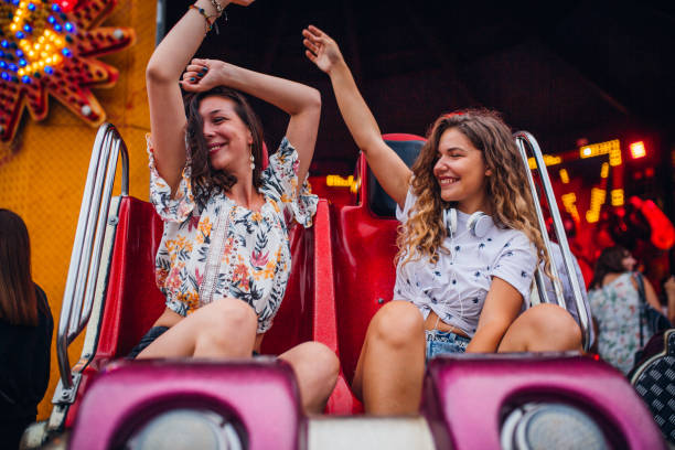 istock Girlfriends have fun at the amusement park 1172474806