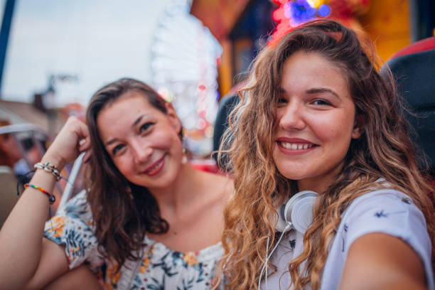 istock Girlfriends have fun at the amusement park 1172475866