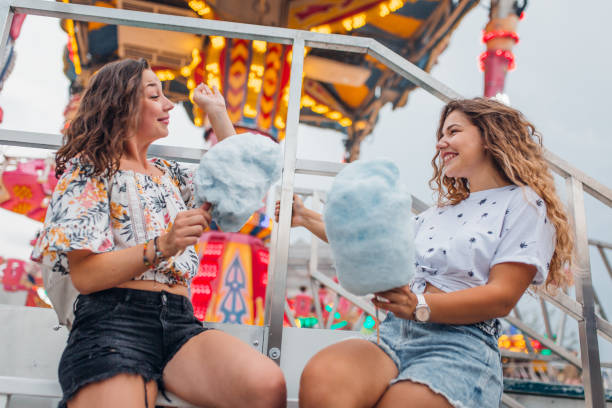 istock Girlfriends have fun at the amusement park 1172475996