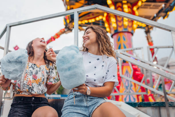 istock Girlfriends have fun at the amusement park 1172476787