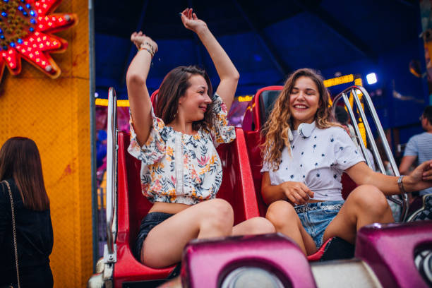 istock Girlfriends have fun at the amusement park 1172479051