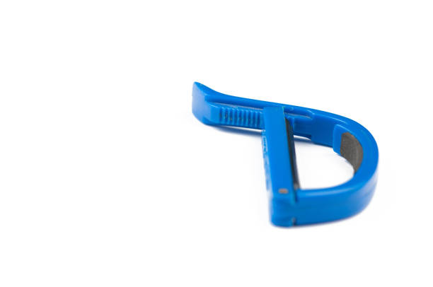 istock Blue guitar capo isolated on white background.Copy space. 1172479594