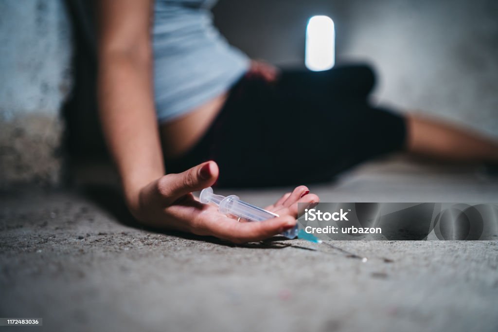 Young woman overdosed Young caucasian woman passed out after overdosed herself. Drug Overdose Stock Photo