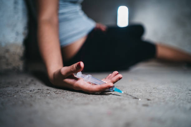 Young woman overdosed Young caucasian woman passed out after overdosed herself. self mutilation pictures stock pictures, royalty-free photos & images