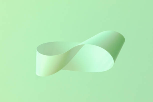 istock Mobius strip soaring in the air on mint background 1172484690