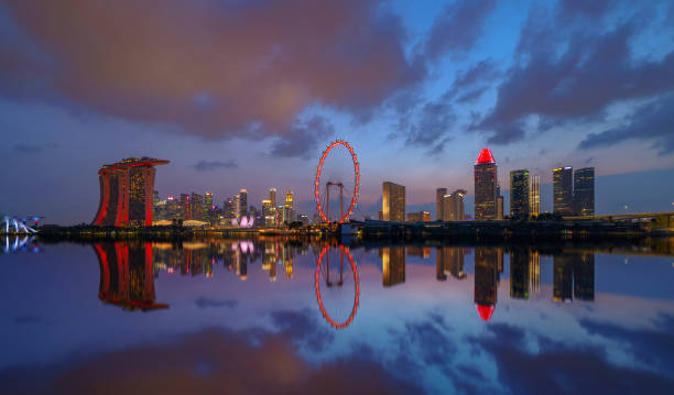 istock Singapore Downtown skyline at night with reflection. Financial district and business centers in technology smart urban city in Asia. Skyscraper and high-rise buildings. 1172485708
