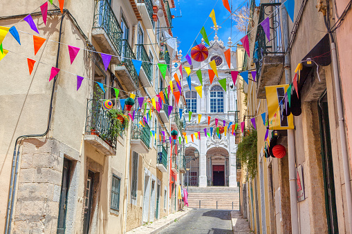 colorful flags over the street in Lisbon