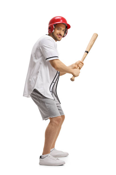 istock Man playing baseball and holding a bat 1172488600