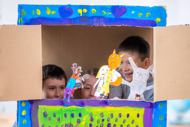 istock Children playing with paper puppets 1172490508