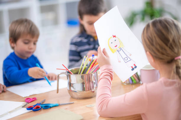 istock Children drawing in classroom 1172490674