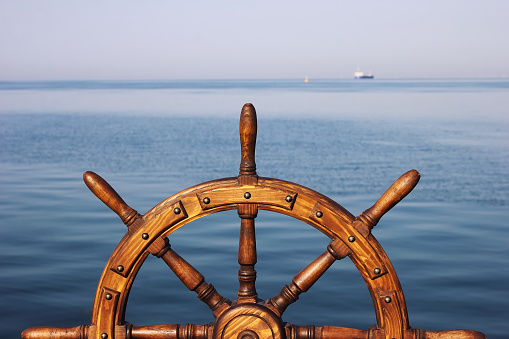Steering hand wheel ship on sea background