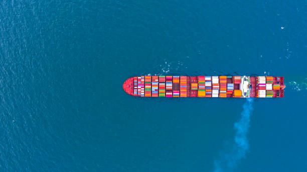 istock Container ship carrying container for business freight shipping import and export, Aerial view container ship arriving in commercial port. 1172493012