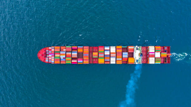 istock Container ship carrying container for business freight shipping import and export, Aerial view container ship arriving in commercial port. 1172493013