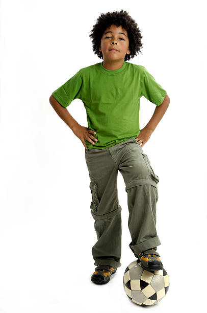 Happy black african child in studio isolated on white.