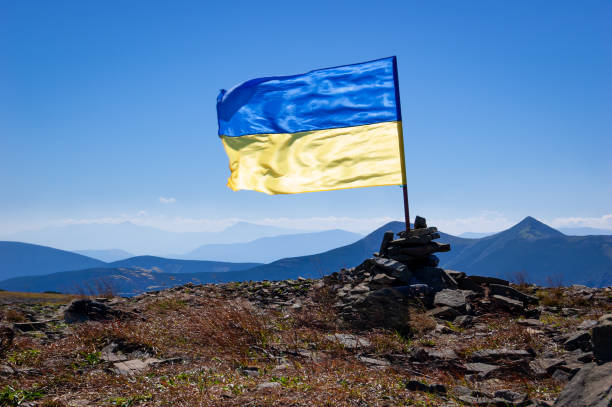 istock Ukrainian flag on mountain top 1172498722